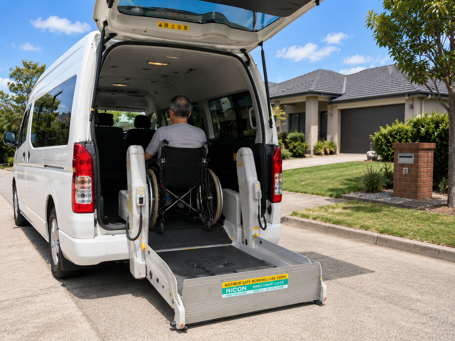 Wheelchair user boarding My Simple Support's van via the rear hydraulic lift